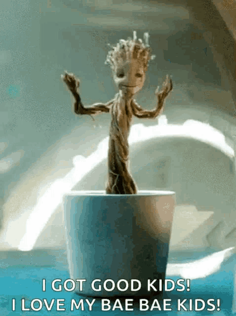 groot from the movie guardians of the galaxy is dancing in a pot .