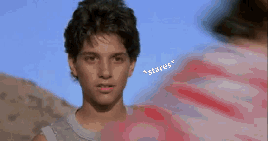 a woman wearing a blue headband is looking away from the camera