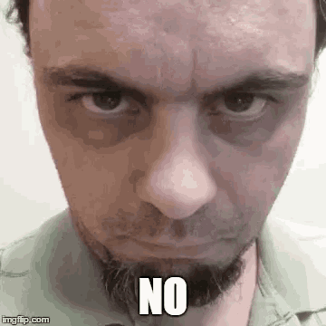 a man with a beard is making a funny face with his eyes closed and the words `` no '' written on his face .