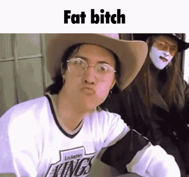 a woman wearing a cowboy hat and glasses is making a funny face with the words fat bitch below her