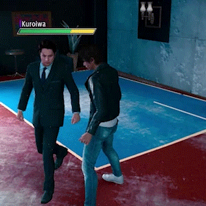 two men in suits and ties are walking in a room with a screen that says kuroiwa on it