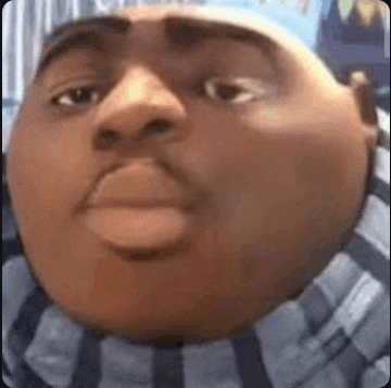 a close up of a cartoon character 's face with a huge head .