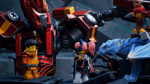 a group of lego characters standing around a robot
