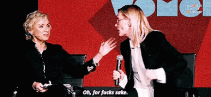 two women are sitting in front of a microphone and one of them is saying oh for fucks sake