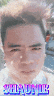 a close up of a man 's face with the name shaunie written on the bottom