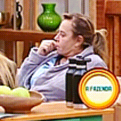 a woman sits on a couch with a sign that says friends
