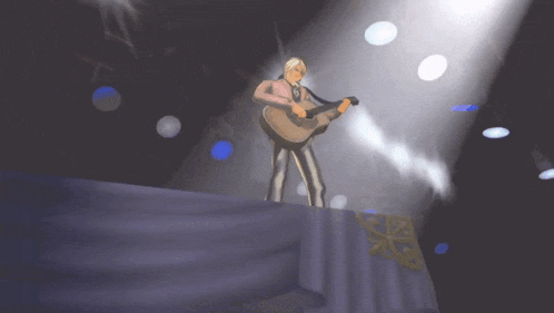 a man stands on a stage in front of a purple curtain