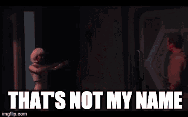 a man and a woman are standing next to each other with the words that 's not my name behind them