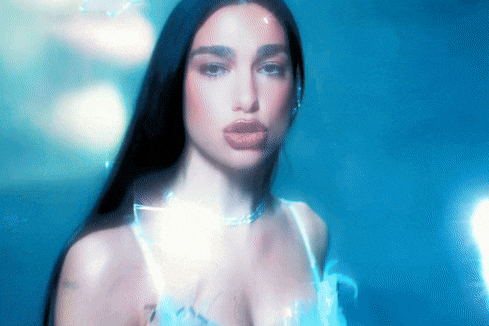 a close up of a woman 's face against a blue background .