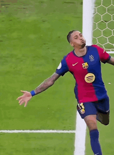 a soccer player wearing a spotify logo on his shirt