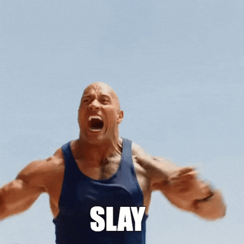a man in a blue tank top is screaming with the word slay in front of him .