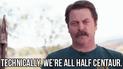 a man with a mustache is standing in front of a sign that says `` technically we 're all half centaur ''