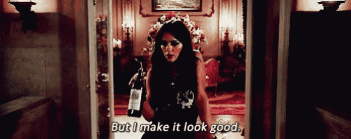 a woman in a black dress holds a bottle of wine and says but i make it look good