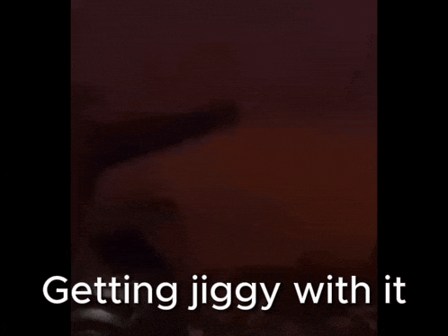 a blurry picture of a person with the words " getting jiggy with it " on the bottom