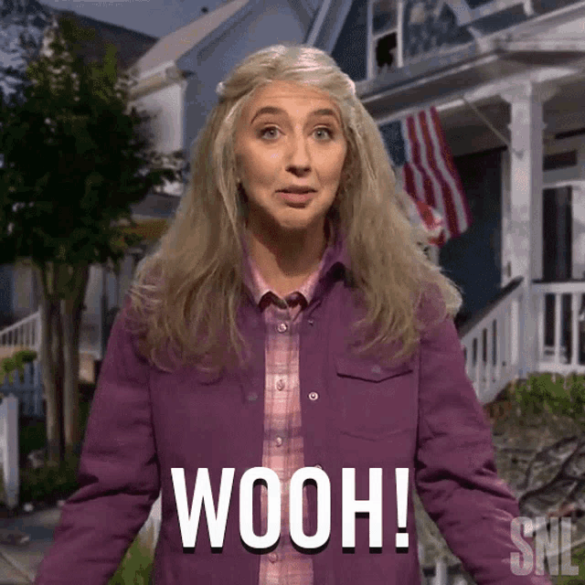 a woman wearing a purple jacket says wooh