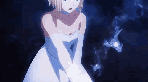a girl in a white dress and white gloves is holding something in her hand .