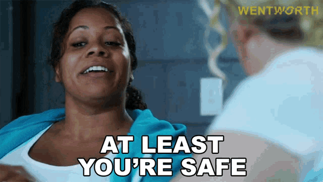 a woman says at least you 're safe in front of a wentworth logo