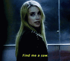 a woman says find me a saw while standing in a dark room