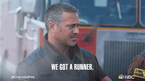 a firefighter says we got a runner while standing in front of a fire truck