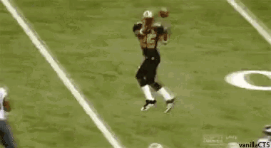 a football player with the number 54 on his jersey is running with the ball
