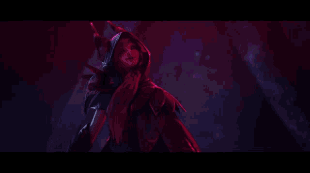 a woman in a hooded jacket is holding a purple object .