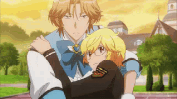 a man is carrying a girl in his arms in a park
