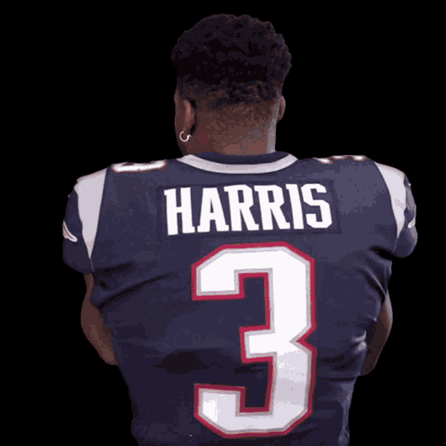 a man wearing a jersey that says harris on the back
