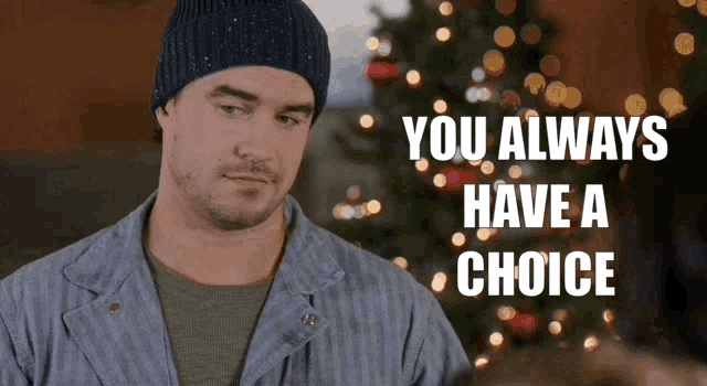 a man in front of a christmas tree with the words " you always have a choice " above him