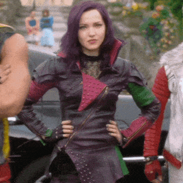a woman with purple hair is wearing a leather jacket with studs