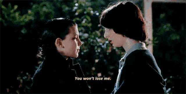 a man and a woman are looking at each other and the man says you won t lose me
