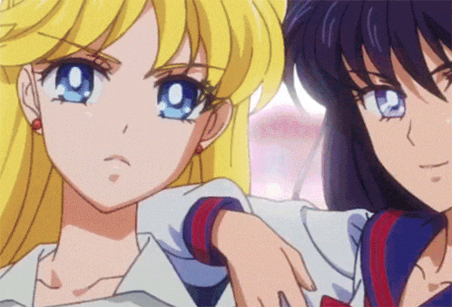 two anime girls are standing next to each other and one has a blue eye