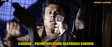 a man in a cage talking on a cell phone with a caption that says kanukko