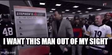a man in a suit is standing in front of a sign that says stephen 's list .