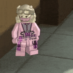 a pink lego figure with a helmet and goggles