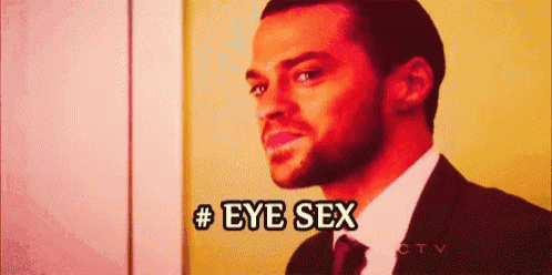 a man in a suit and tie is smiling and says # eye sex