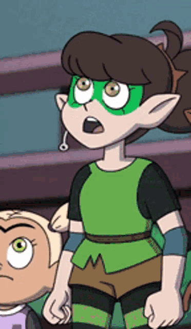 a cartoon character wearing a green mask and shorts is standing next to another cartoon character .
