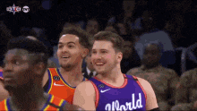 a basketball player wearing a purple jersey with the word allworld on it