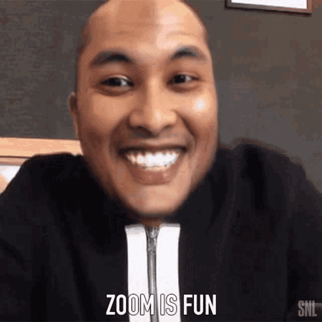 a man is smiling and the words zoom is fun are visible