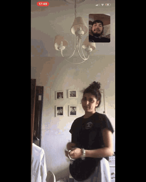 a man and a woman are on a video call with the time of 17:49