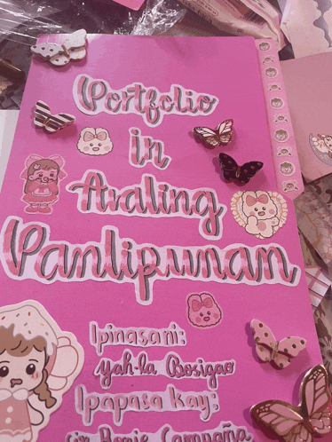 a pink book with the words portfolio in avaling pantipunan on it