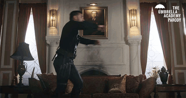 a man dancing in a living room with the umbrella academy parody on the bottom