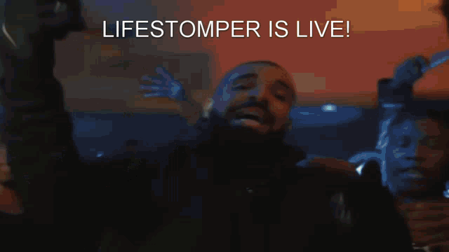 a man singing into a microphone with the words " lifestomper is live " above him