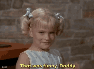 a little girl in a blue dress is laughing and saying that was funny daddy