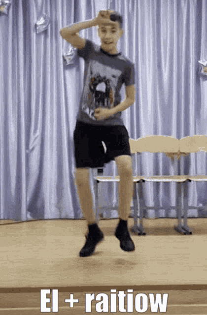 a boy is jumping in the air with the words el + raiiow written below him