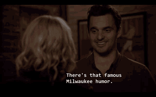 a man talking to a woman with the words " there 's that famous milwaukee humor "