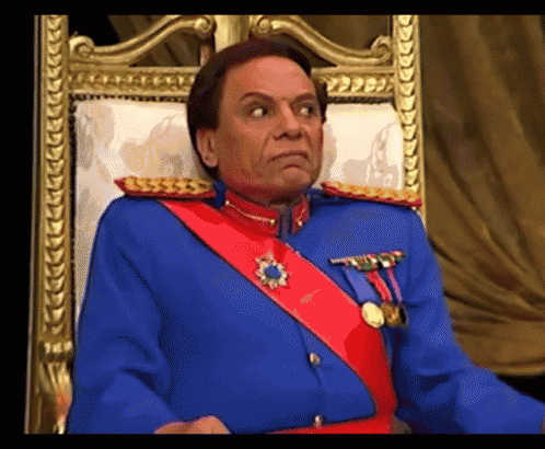 a man in a military uniform is sitting in a chair