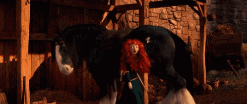 a woman with red hair standing next to a black horse