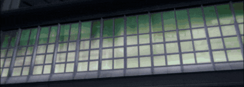a building with a lot of windows and a green glass