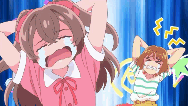a girl in a pink shirt is crying while another girl in a green and white striped shirt is laughing