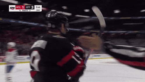 a hockey game is being played with a score of 3 to 2